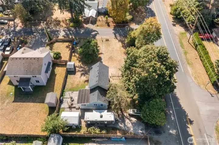 Generous lot size with sunny outdoor spaces surrounding this historic home. The large apple tree in the yard is a reminder of the property’s original orchard roots