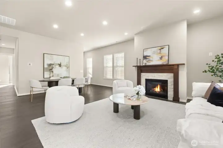 Cozy up by the gas fireplace in this stylish, open-concept living area.