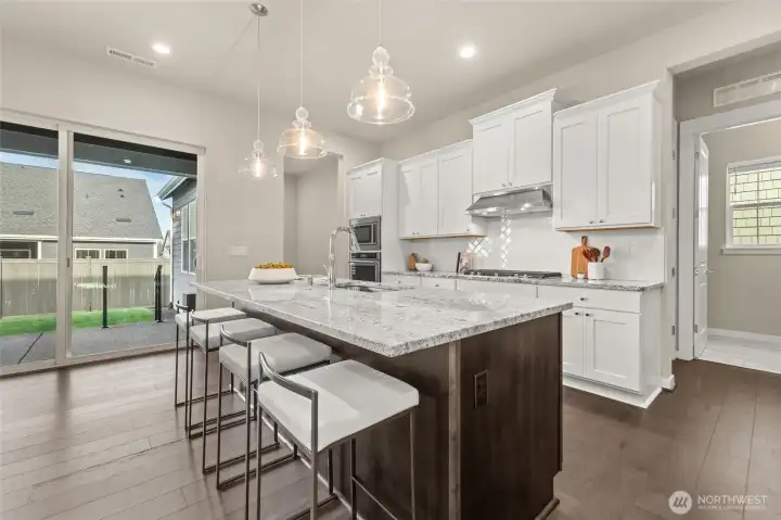 Stunning countertops and custom soft-close cabinetry offer both beauty and function.