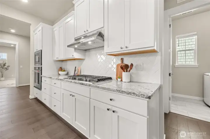 Every detail has been upgraded — hardwood, lighting, and soft-close everything.