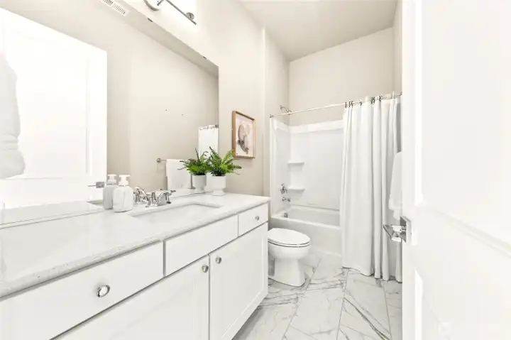 Full second bath with contemporary finishes.