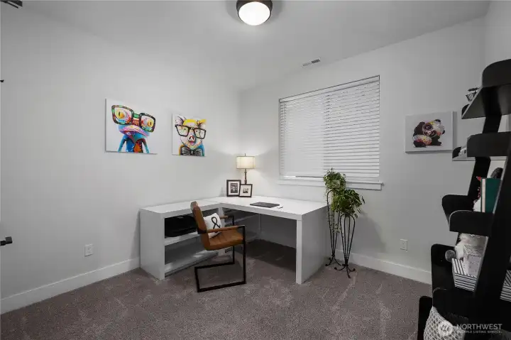 Bedroom 2 with french doors and walk in closet.