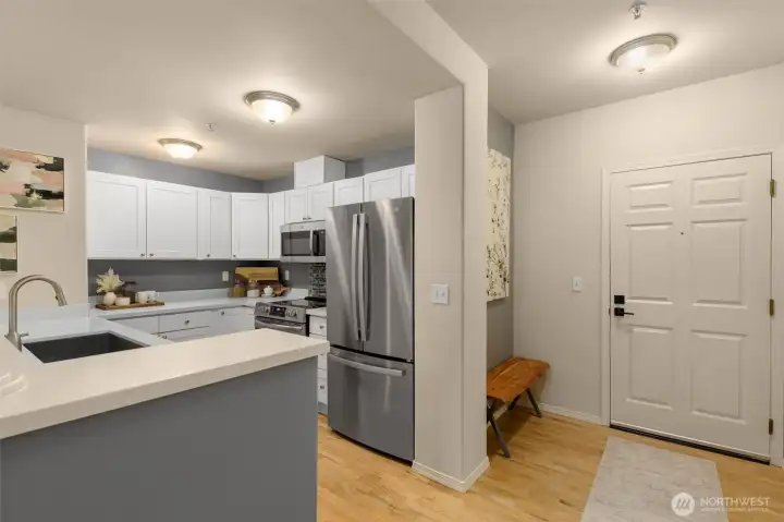 Convenient entry nook perfect for a bench and place to leave coats and rain boots.