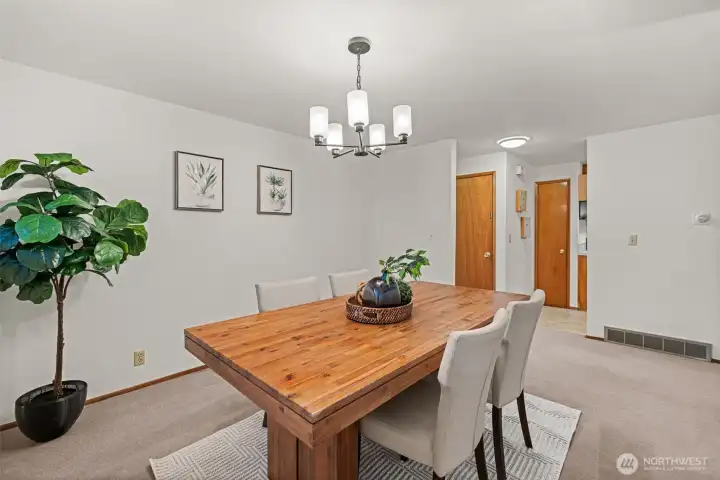 Wonderful dining area... how big do you need that table?  it will fit all those wonderful gatherings