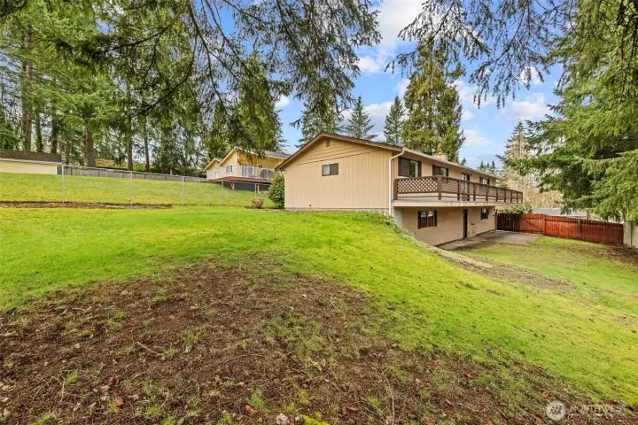 Room to roam and more... the gate off driveway is large enough to pull in your toys from there as well