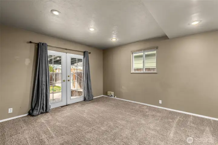 Large bedroom with french doors to the patio.