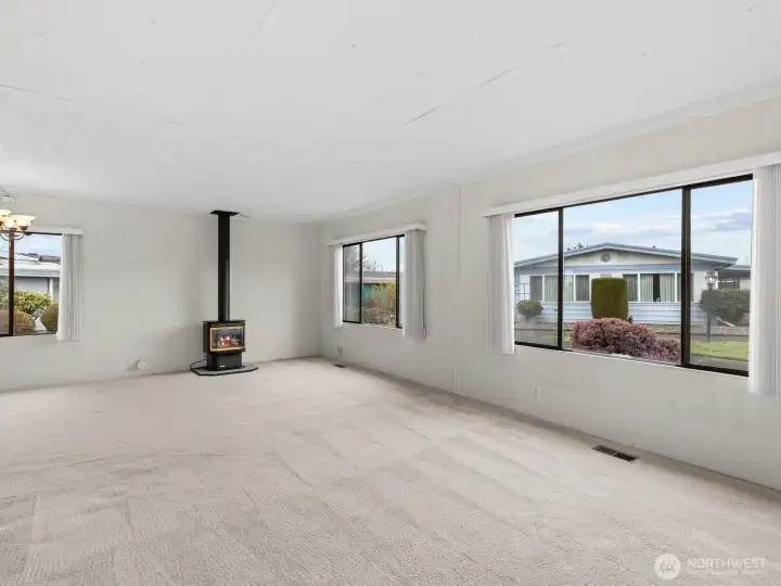 As you enter, natural light fills the home through the large windows.