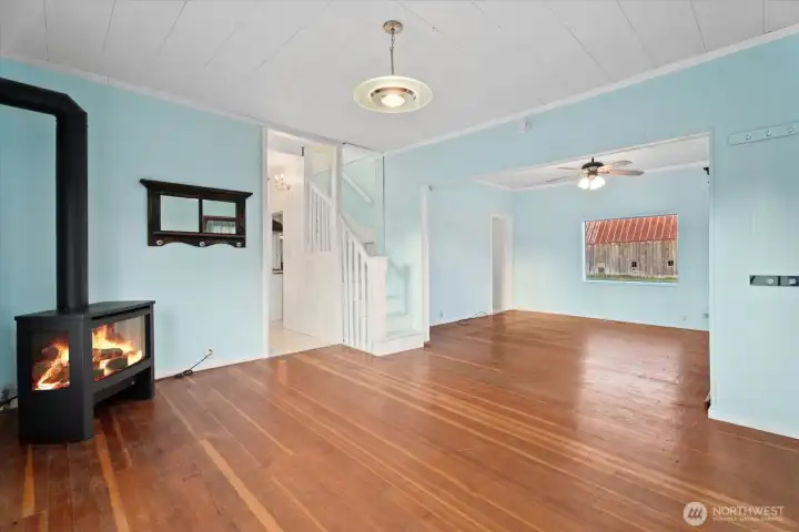 Bright and welcoming, the hardwood floors and propane fireplace keep the formal living room cozy.