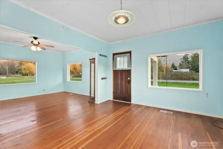 The main level, living, and bonus space are filled with natural light and surrounding views.