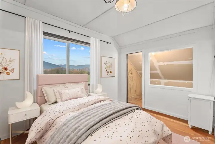 Stunning, picturesque foothills views brighten the bedroom, creating an inviting atmosphere.