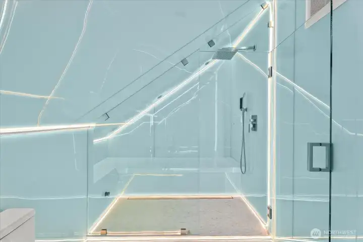 Enjoy a world-class private steam sauna experience, with a custom-titled laydown bench, custom lighting, and speaker system.