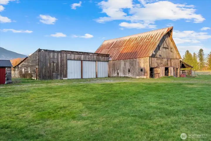 Fully enclosed pasture with electric fencing is ready for your choice of livestock.