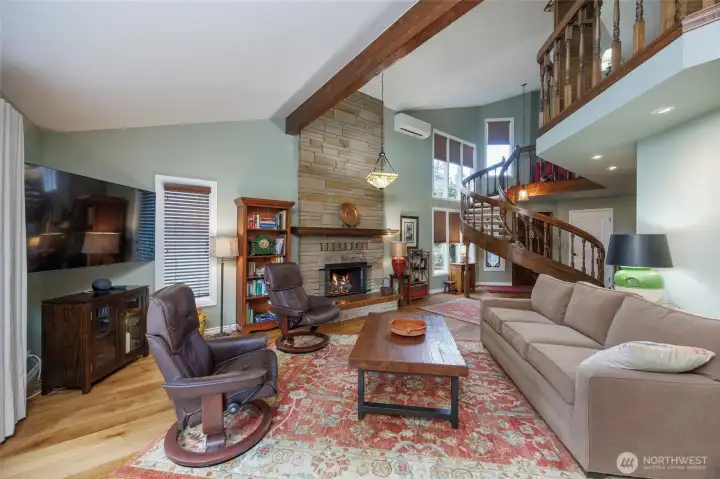Great room concept w/floor to ceiling stone gas fireplace, Mini-Split A/C :(2022), upper right shows balcony looking down from primary retreat.