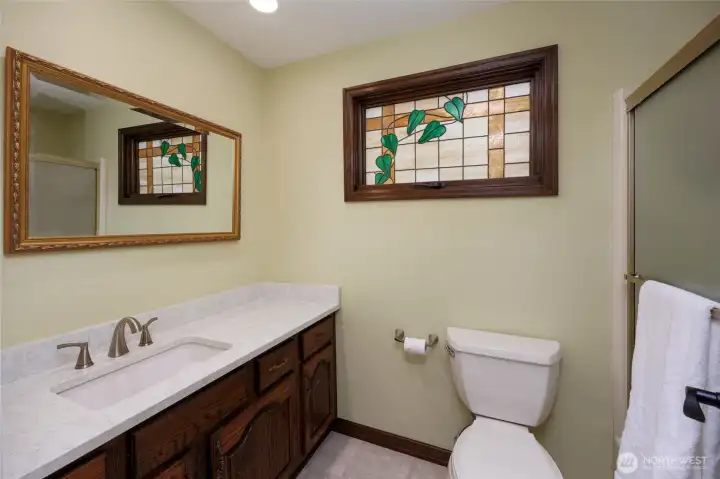 full bathroom off 2nd primary retreat w/stained glass window