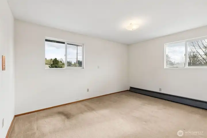 Bedroom #2. Corner room view to side and front yards. Carpeted flooring. Located on 2nd floor of home.