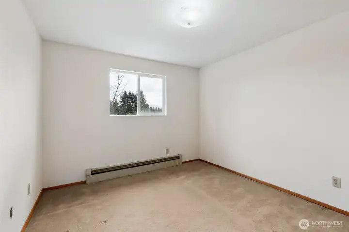 Bedroom #3.  View toward front yard. Carpeted flooring. Located on 2nd floor of home.