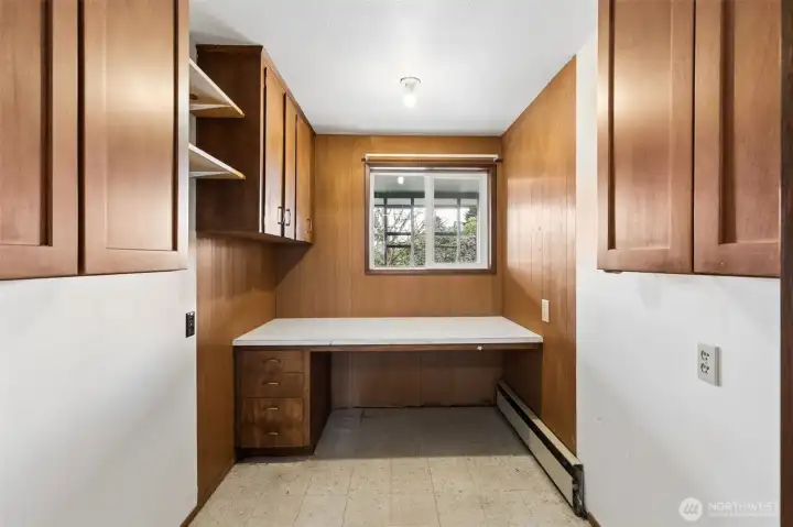Originally the sewing room of this home and in more recent years an office! This space has potential. It's adjacent to the powder room (half bath) in the main entry. Perhaps expand that into this space for a full-bathroom.