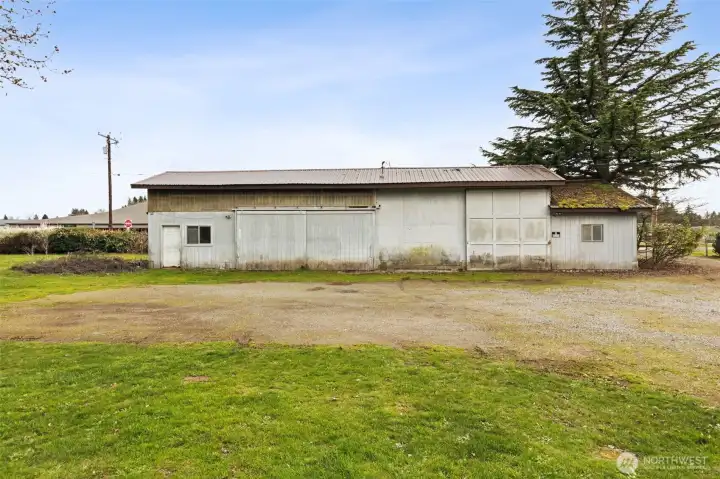 This is the shop! It's approximately 75'x25' and a newly installed electrical panel.