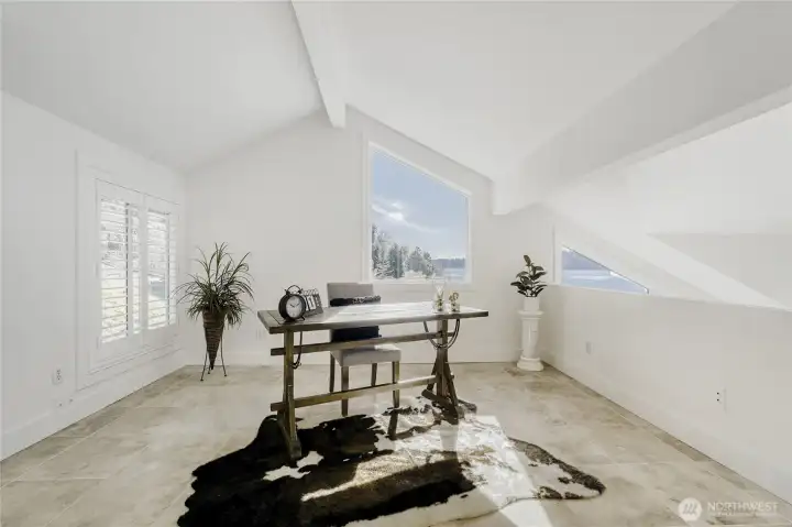 Beautiful bedroom loft staged as an office.