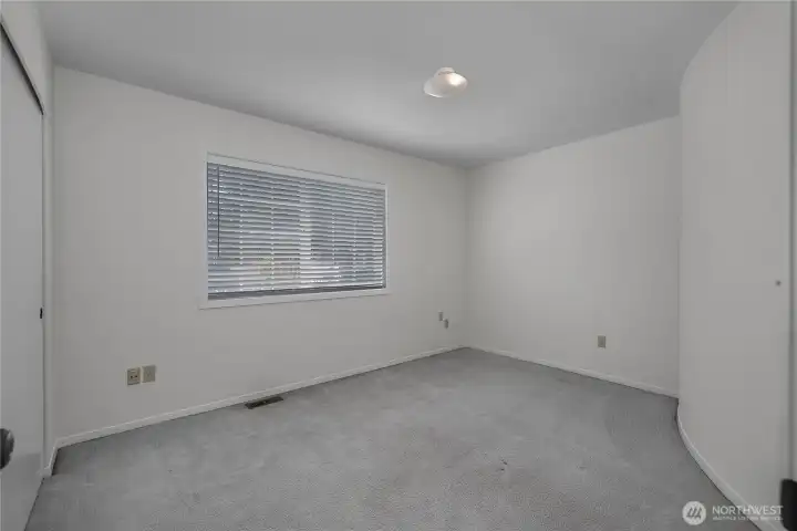BR 2 - Create a comfortable bedroom retreat with natural light and fresh neutral walls.