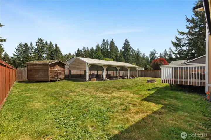 Make the most of the large backyard with covered parking, storage, and great outdoor gathering space.