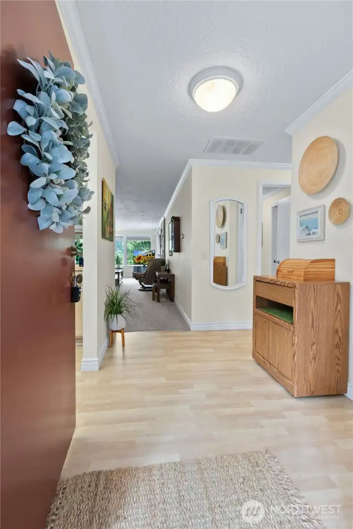 Light-filled foyer provides a warm and inviting introduction to the home with clean lines and functional design. Light-filled foyer provides a warm and inviting introduction to the home with clean lines and functional design.