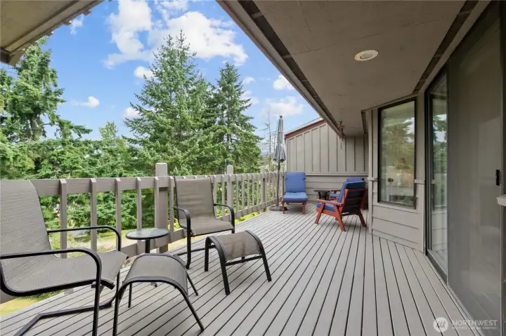 Outdoor living area extends the home’s usable space and overlooks bright green space. Outdoor living area extends the home’s usable space and overlooks bright green space.