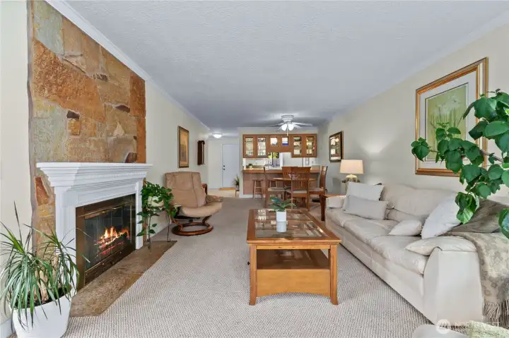 Bright living room features generous wall space, warm flooring, and room for multiple furniture layouts. Bright living room features generous wall space, warm flooring, and room for multiple furniture layouts.