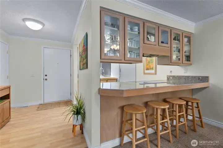 Breakfast bar with additional seating provides a functional extension of the kitchen and entertaining space. Breakfast bar with additional seating provides a functional extension of the kitchen and entertaining space.