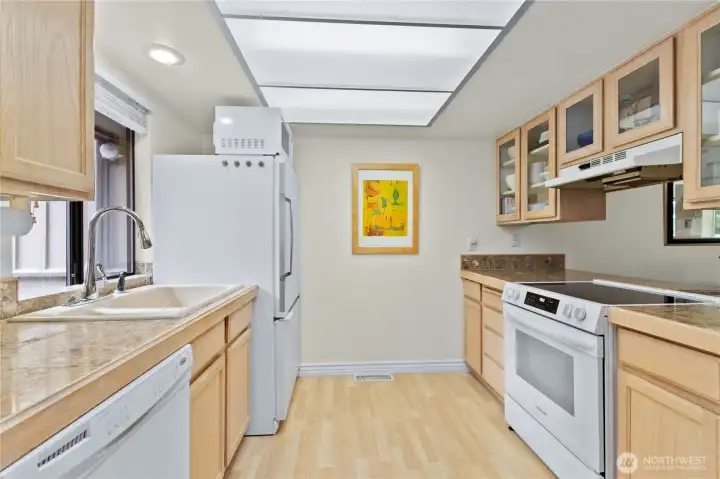 Kitchen offers ample cabinet storage, efficient workspace, and a clean, timeless design. Kitchen offers ample cabinet storage, efficient workspace, and a clean, timeless design.