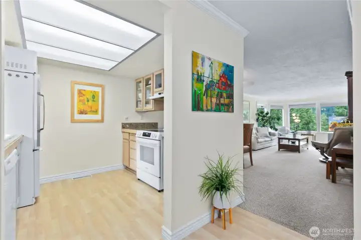 Bright kitchen with large window, abundant cabinetry, and practical workspace for everyday cooking. Bright kitchen with large window, abundant cabinetry, and practical workspace for everyday cooking.