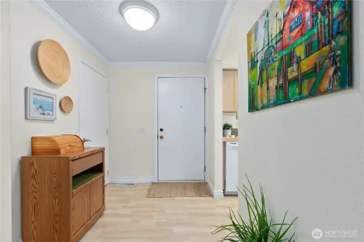 Bright and functional entry with extra storage closet. Bright and functional entry with extra storage closet.