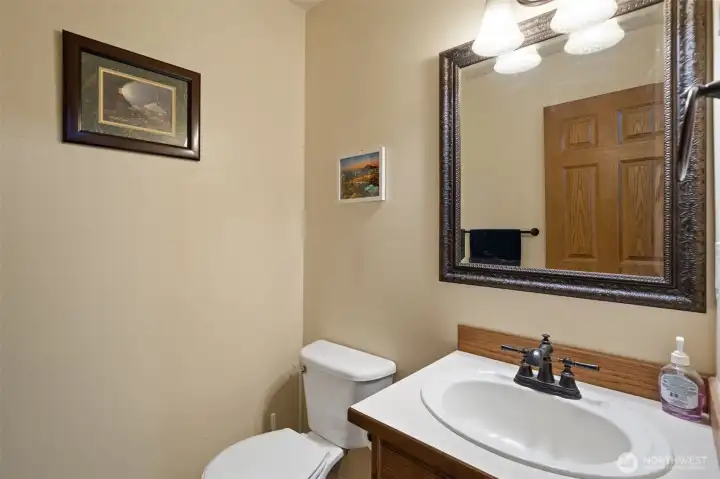 Perfectly situated for guests, the main-floor half bath combines functionality with timeless style.
