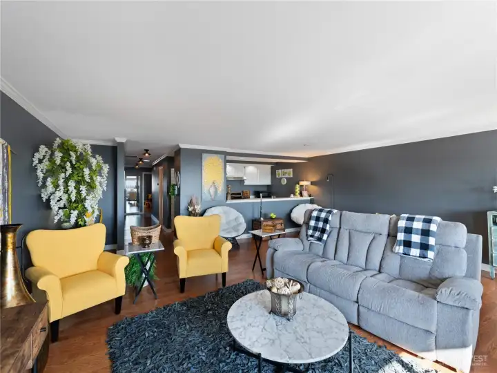 This perspective shows the open kitchen and down the hallway leading to laundry, bedrooms and bathrooms.