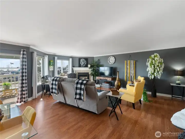 This perspective shows living room, dining space leading to the covered deck for additional entertaining space.
