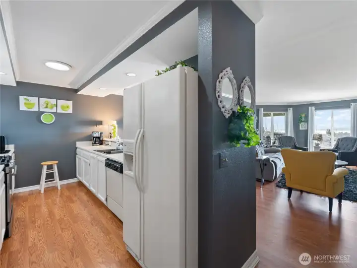 Galley style kitchen is open to the dining and living room so you can enjoy your guests while preparing meals! Remember all appliances stay and unit is equipped with all the "bells and whistles" you'll need!
