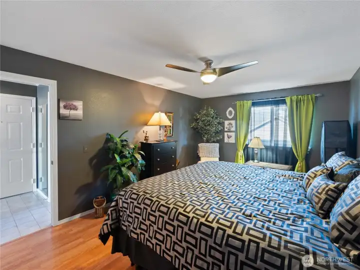 Another view of the primary bedroom with private ensuite bathroom.