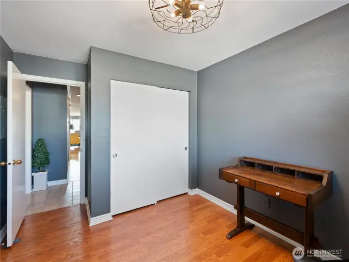 Another view of the secondary bedroom shows the ample closet space.