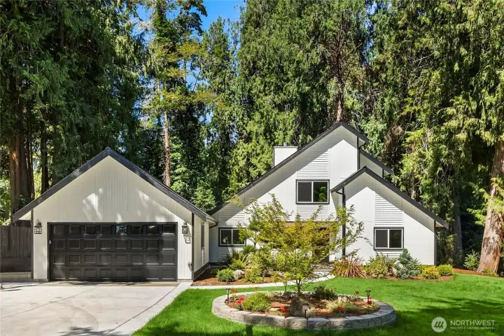 Welcome to your Pacific Northwest sanctuary. Perfectly positioned on quiet Penny Place NE and embraced by towering evergreens, this beautifully remodeled NW Contemporary offers the rare combination of modern luxury, exceptional privacy, and direct access to neighborhood trails—creating a home that feels like a year-round getaway. Welcome to your Pacific Northwest sanctuary. Perfectly positioned on quiet Penny Place NE and embraced by towering evergreens, this beautifully remodeled NW Contemporary offers the rare combination of modern luxury, exceptional privacy, and direct access to neighborhood trails—creating a home that feels like a year-round getaway.