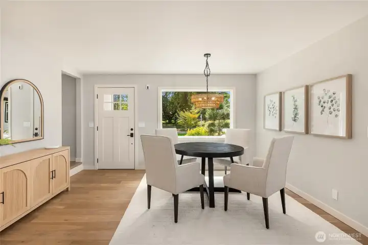 Gather friends and family in the light-filled dining room, where oversized windows frame peaceful garden views and every meal feels connected to the beauty outdoors. Gather friends and family in the light-filled dining room, where oversized windows frame peaceful garden views and every meal feels connected to the beauty outdoors.