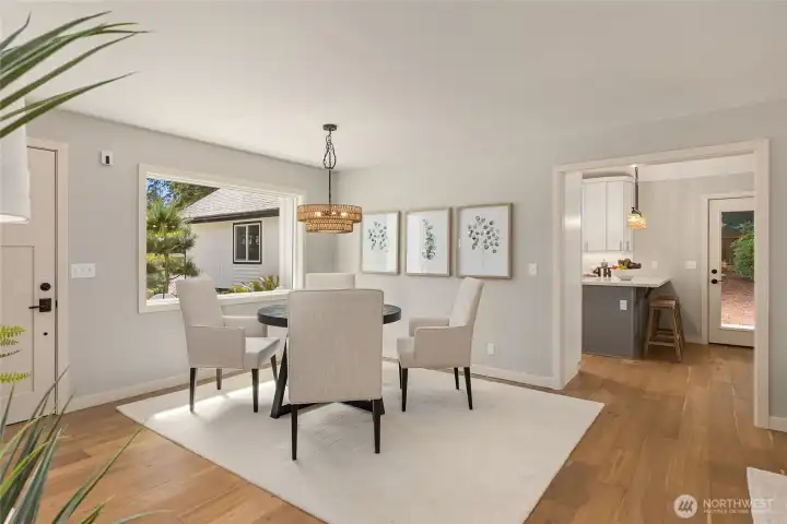 The dining area flows effortlessly from the remodeled kitchen, creating an inviting gathering space where preparing meals, serving guests, and lingering over conversation all happen with ease. The dining area flows effortlessly from the remodeled kitchen, creating an inviting gathering space where preparing meals, serving guests, and lingering over conversation all happen with ease.