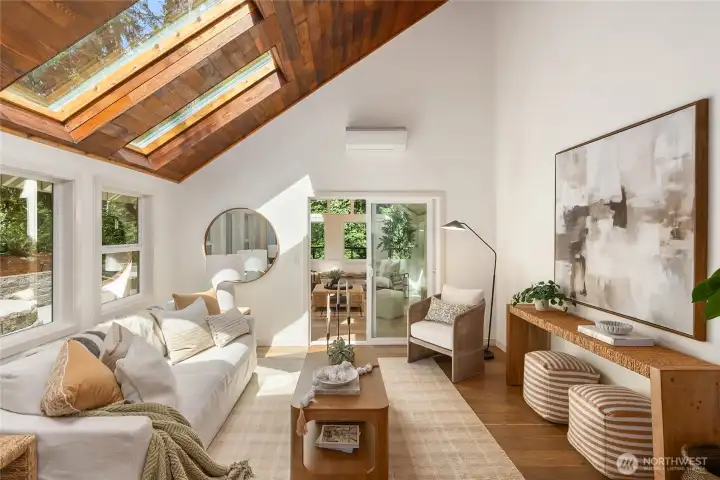 Designed to bring the outdoors in, the family room is a warm and inviting retreat beneath a striking cedar-planked vaulted ceiling with oversized skylights. Designed to bring the outdoors in, the family room is a warm and inviting retreat beneath a striking cedar-planked vaulted ceiling with oversized skylights.