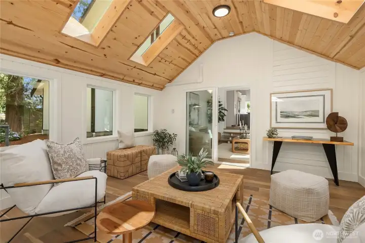 Whether enjoying a quiet morning coffee, reading a favorite book, or gathering with friends, this remarkable space offers a year-round connection to the beauty of the outdoors. Whether enjoying a quiet morning coffee, reading a favorite book, or gathering with friends, this remarkable space offers a year-round connection to the beauty of the outdoors.