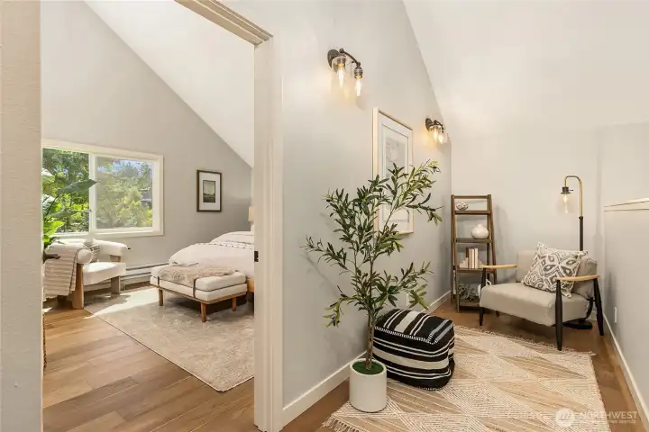 A charming upstairs alcove extends the primary suite, creating a serene space for reading, reflection, or a quiet escape. A charming upstairs alcove extends the primary suite, creating a serene space for reading, reflection, or a quiet escape.