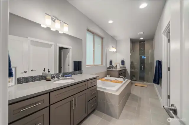 Large on suite bathroom with walk in shower and large soaking tub.