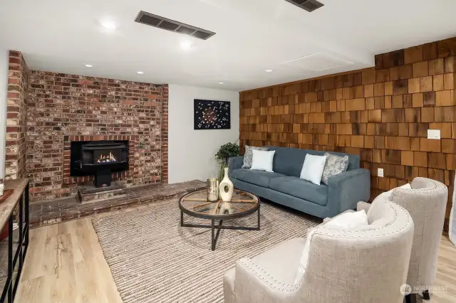 Lower rec room includes a wood stove.