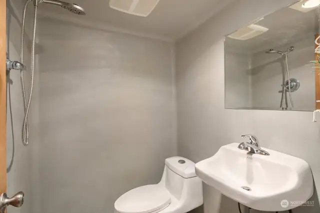 "Wet Room" bathroom with drain in the middle of the room.