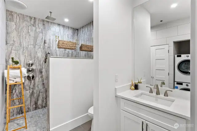 The attached 3/4 bath is a dream with a large shower and separate laundry facilities also.