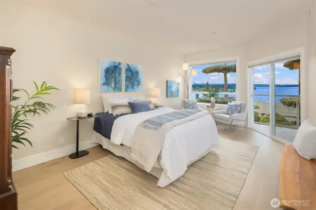 The ultimate retreat—an expansive primary suite with private deck access, city and lake views, and plenty of space to unwind in style.