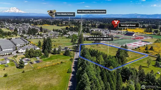Great location: right across the street from Yelm High School, coffee stand, and walking distance to restaurants. Blue boundary lines are approximate. Buyer to verify to their own satisfaction.